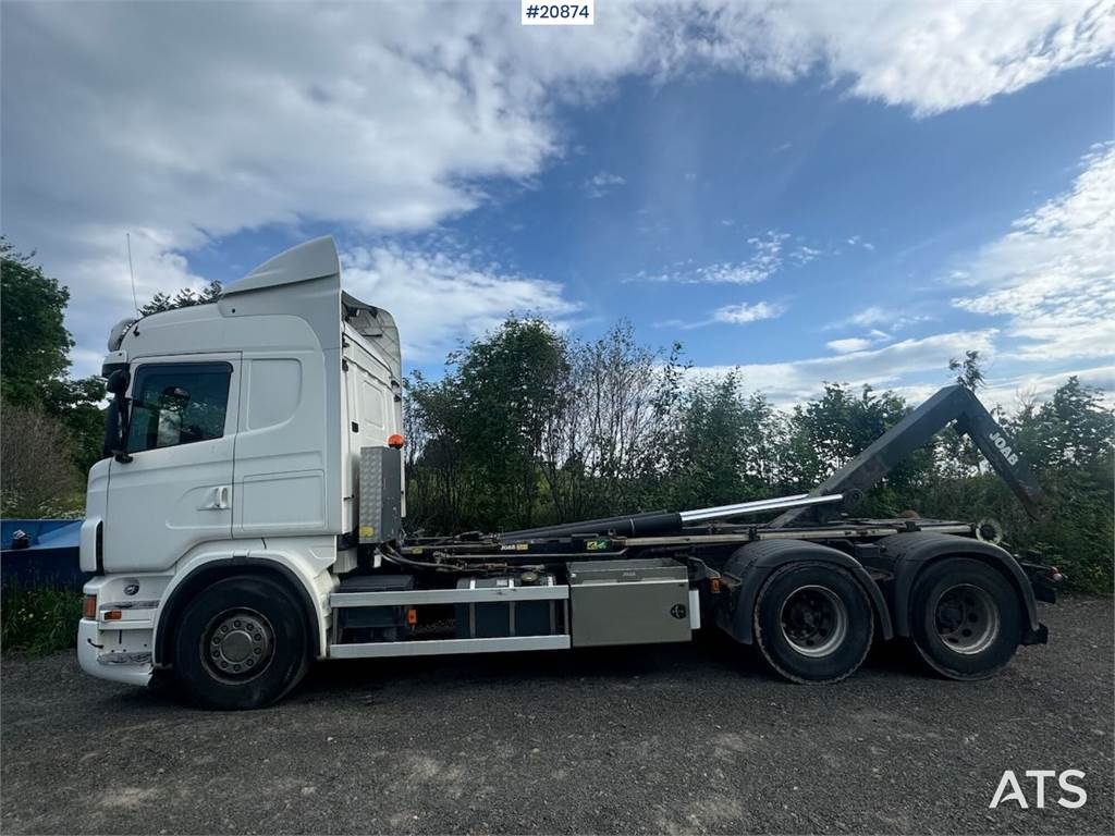 Scania R560 6x2 hook truck w/ Joab hook and crane setup.  image