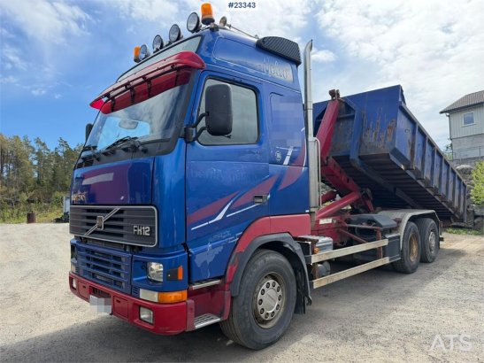 Volvo FH12 6x2 hook truck with a 20-ton hook and contain 590 2000 2