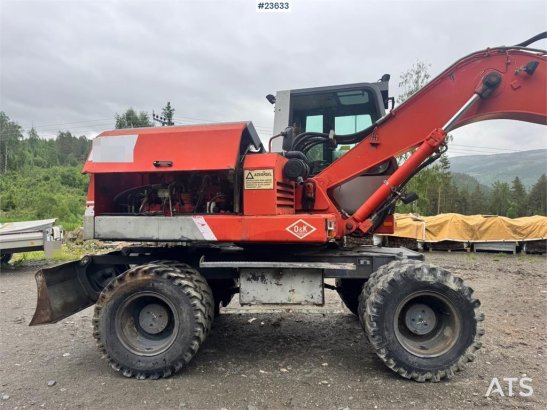 O&K MH4 Wheeled Excavator with Grading Bucket WATCH VI MH4 Wheeled Excavator with Grading Bucket WATCH VI 1998 2 Wheeled E...