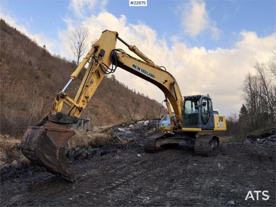 New Holland E265 Excavator with tooth bucket and defective rot E265 Excavator with tooth bucket and defective rot 2006 2 C...