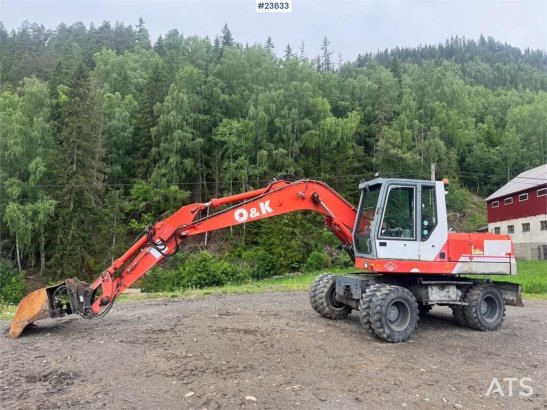 O&K MH4 Wheeled Excavator with Grading Bucket WATCH VI MH4 Wheeled Excavator with Grading Bucket WATCH VI 1998 2 Wheeled E...