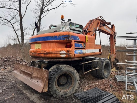 Fiat-Hitachi 150W.3 wheeled excavator with rototilt and grading Fiat-Hitachi 150W.3 wheeled excavator with rototilt and gr...