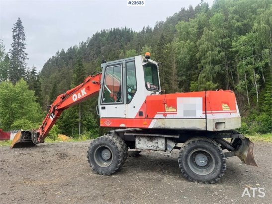 O&K MH4 Wheeled Excavator with Grading Bucket WATCH VI MH4 Wheeled Excavator with Grading Bucket WATCH VI 1998 2 Wheeled E...
