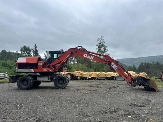 O&K MH4 Wheeled Excavator with Grading Bucket WATCH VI MH4 Wheeled Excavator with Grading Bucket WATCH VI 1998 2 Wheeled E...