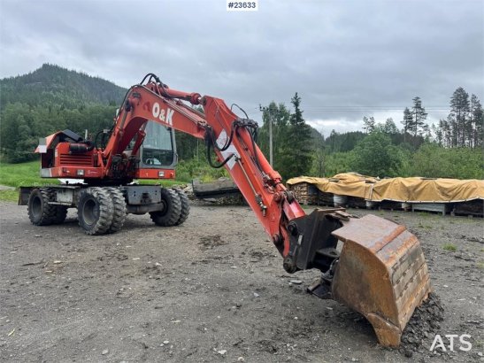 O&K MH4 Wheeled Excavator with Grading Bucket WATCH VI MH4 Wheeled Excavator with Grading Bucket WATCH VI 1998 2 Wheeled E...